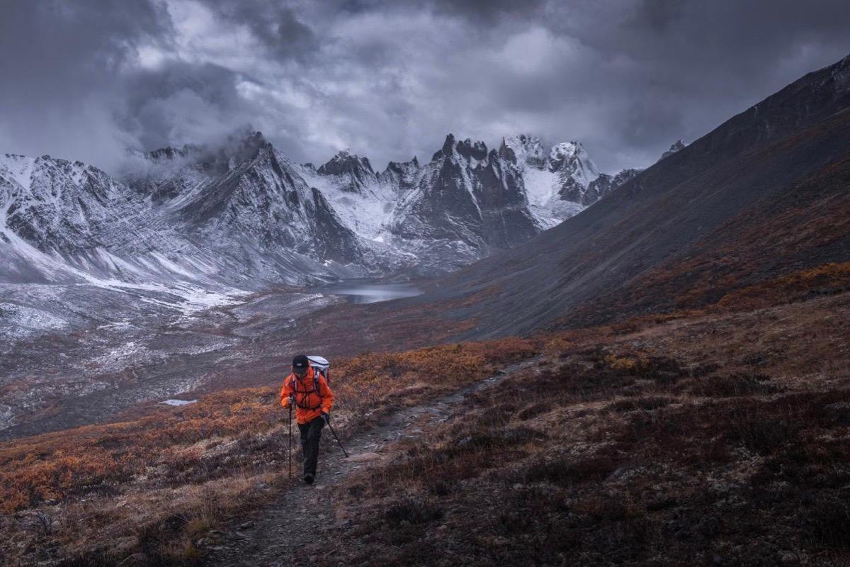 Photographer Kelvin Yuen, hiking in a mountainous area to photograph the natural beauty of the terrain. (Courtesy of Kelvin Yuen)
