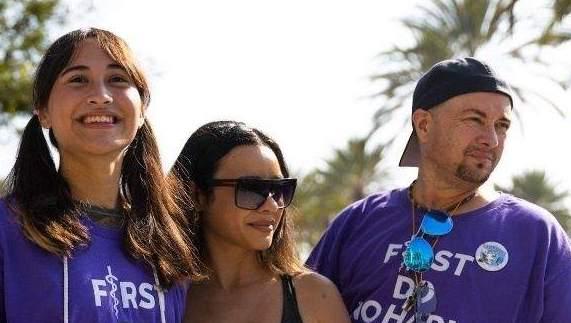 Chloe Cole (L) and Scott Newgent (R), who both regret undergoing masculinizing gender-transition procedures, are pictured with another protester at the First Do No Harm Rally against medical transition in Anaheim, Calif., on Oct. 7, 2022. (Courtesy of TreVoices.org/Scott Newgent)