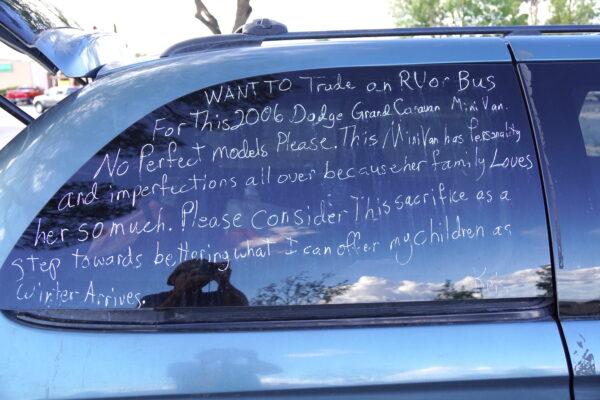 Woneta Odem-Thompson said her hope is to trade her 2006 Dodge Caravan minivan for a 1979 camper for permanent housing. Here, she advertises the vehicle on Oct. 5, 2022. (Allan Stein/The Epoch Times)