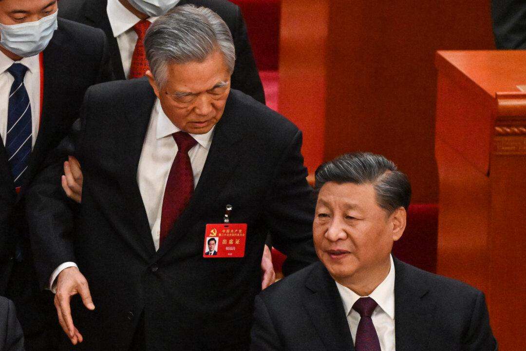 Ex-Chinese Leader Escorted Out of Communist Party Congress as Xi Cements Control