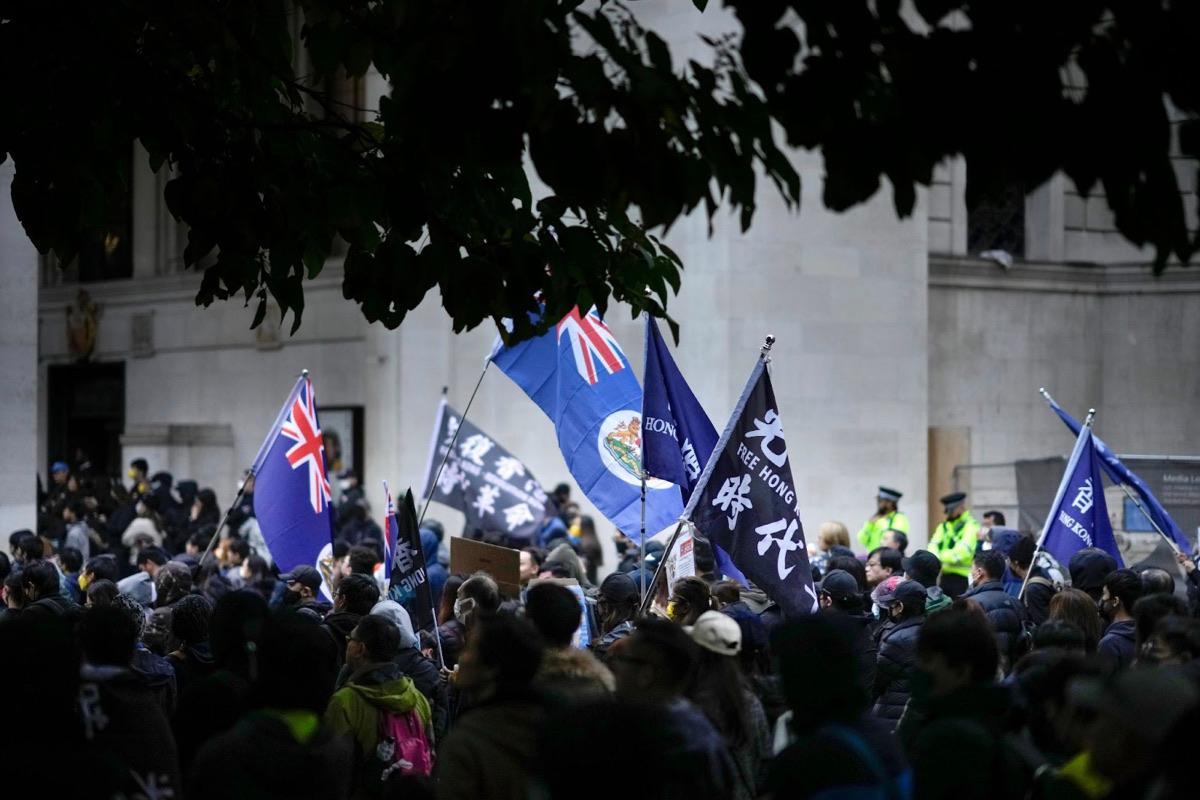 Hong Kong pro-democracy protesters gather in St Peter's Square, Manchester, England, on Oct. 23, 2022. Demonstrators rallied in support of Bob Chan, who was dragged into the grounds of the Manchester Consulate and beaten up during a Hong Kong pro-democracy protest on Sunday, 16 Oct. 2022. (Christopher Furlong/Getty Images)
