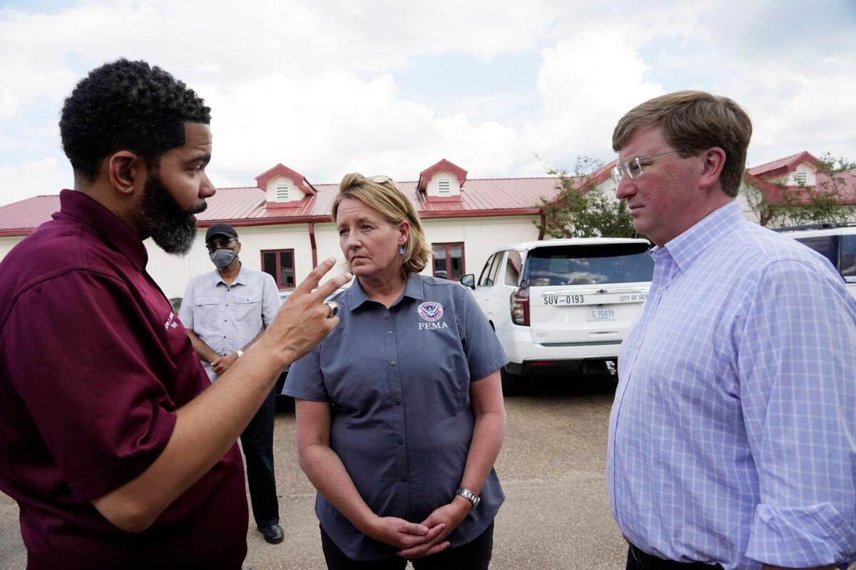 Deanne Criswell, administrator of the Federal Emergency Management Agency (C) and Mississippi Gov. Tate Reeves (R) confer with Jackson Mayor Chokwe Antar Lumumba following a tour the City of Jackson's O.B. Curtis Water Treatment Facility in Ridgeland, Miss., on Sept. 2, 2022. (Rogelio V. Solis/AP Photo)