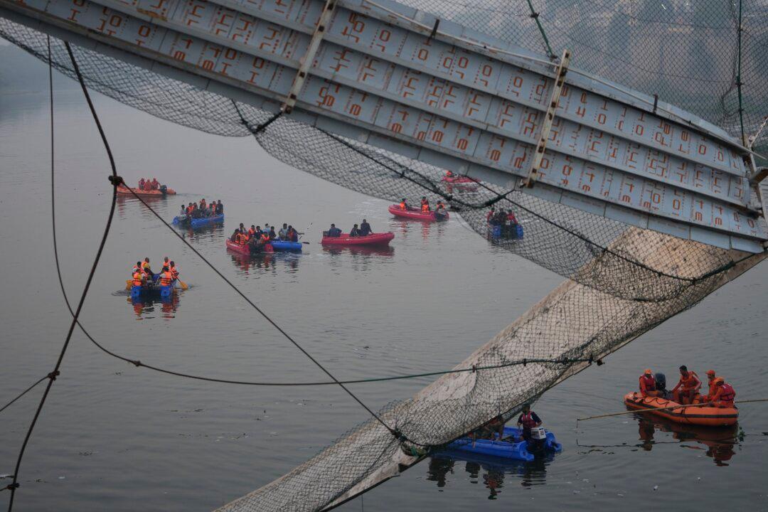 9 Arrested After Bridge Collapses in India, Killing 134