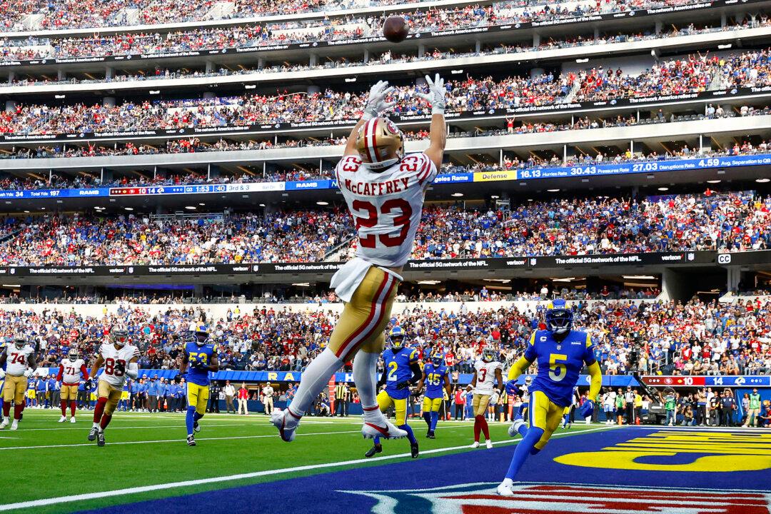 McCaffrey Throws, Catches, Rushes for TDs, Niners Rout Rams