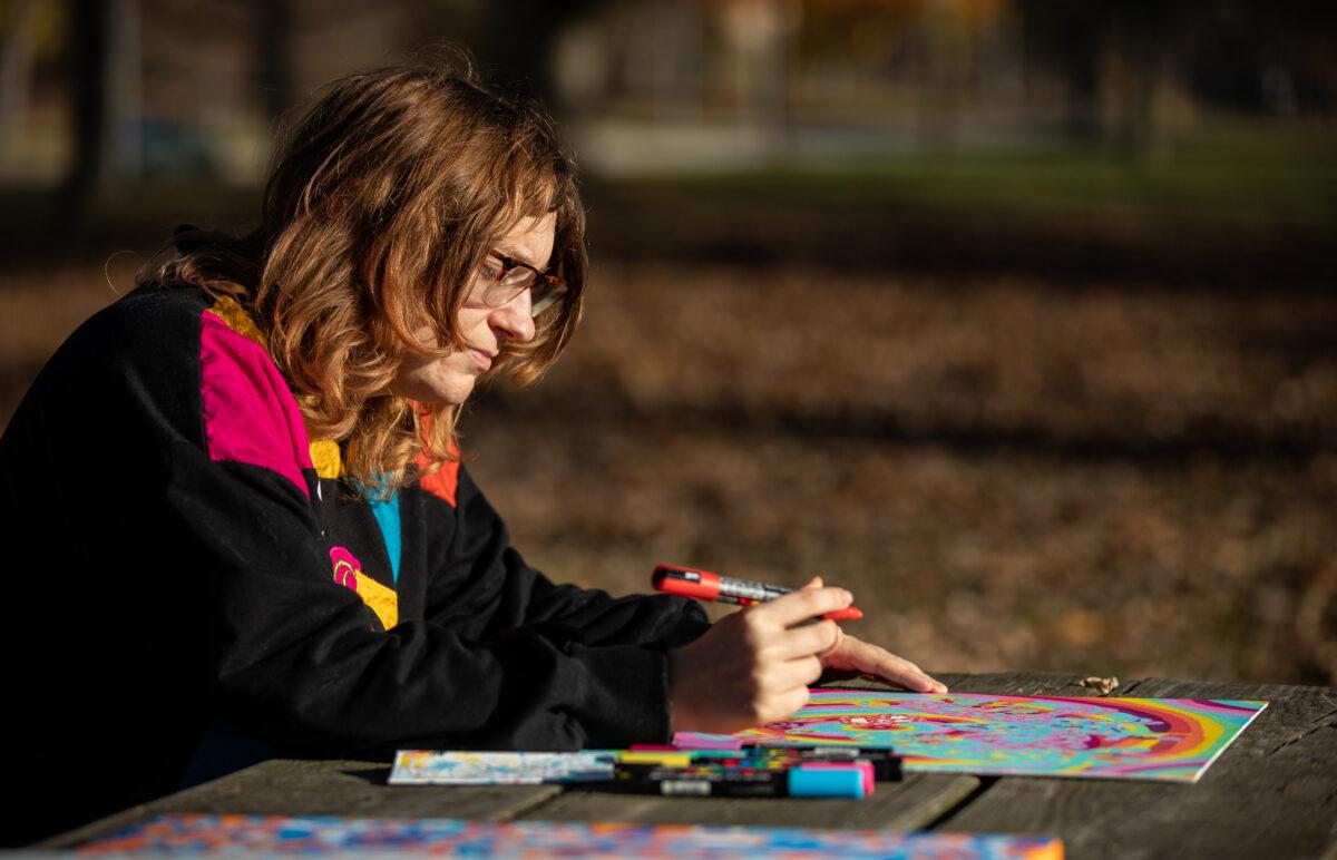 Artist Laura Becker at a park near her home outside of Milwaukee, Wis., on Nov. 2, 2022. (John Fredricks/The Epoch Times)