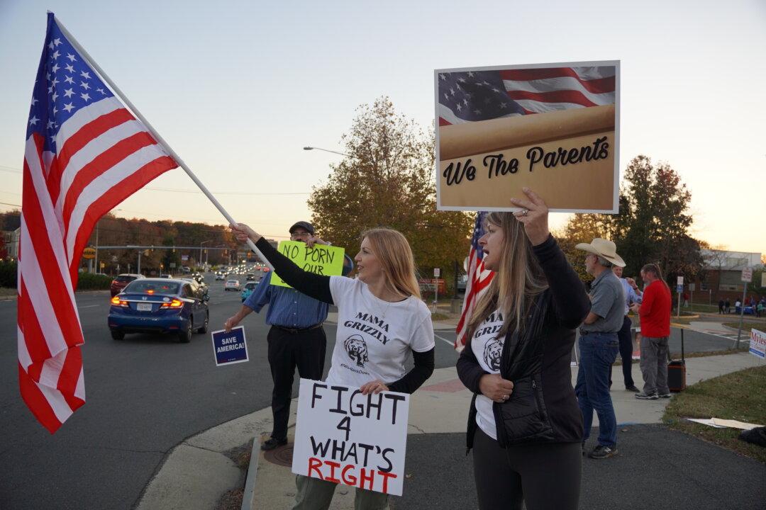 Elected School Board Candidates Choose to Be Sworn-in on Stack of LGBT Books