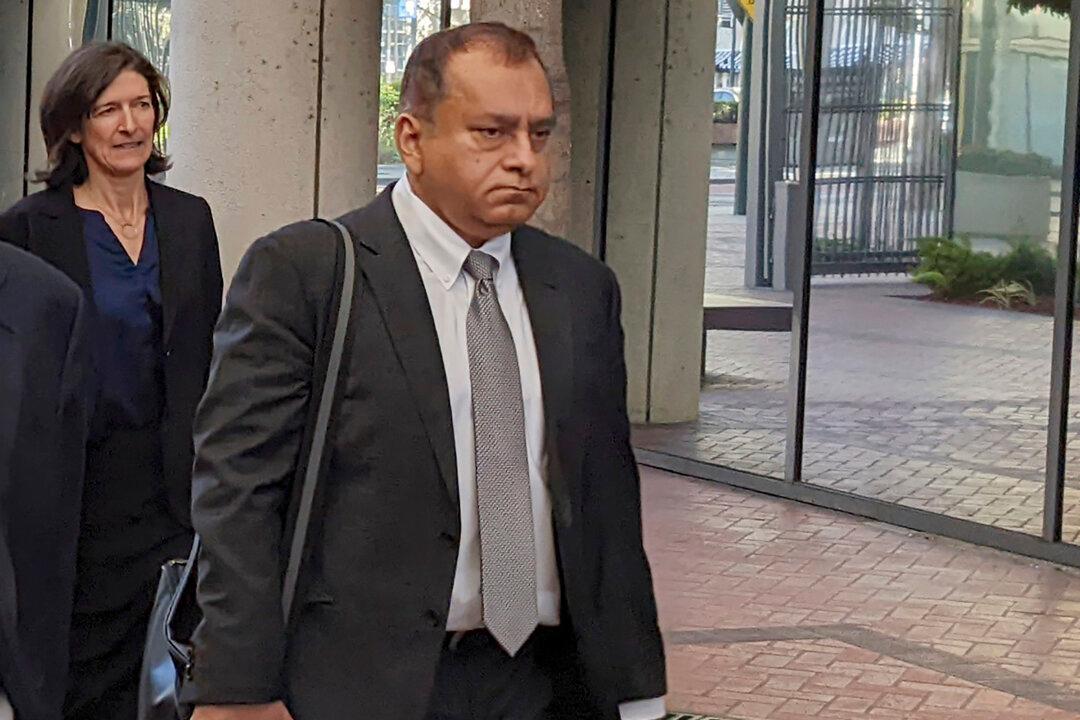 Holmes’ Former Partner Gets Nearly 13 Years in Theranos Case