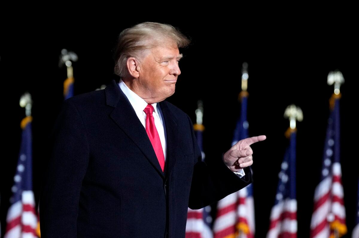 Former President Donald Trump greets supporters before a rally at the Dayton International Airport in Vandalia, Ohio, on Nov. 7, 2022. (Drew Angerer/Getty Images)