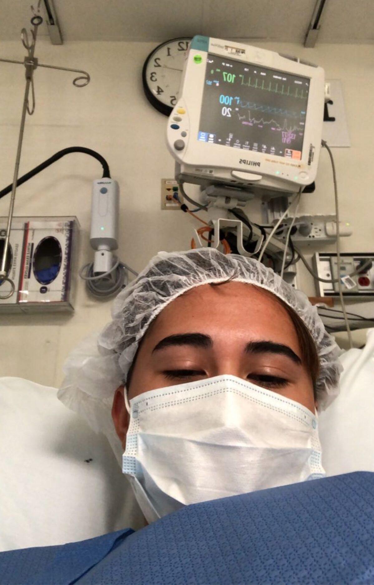 Chloe Cole, 15, wakes up from her mastectomy operation. She and other detransitioners who received "treatments" to change their gender have begun suing doctors. (Courtesy of Chloe Cole)