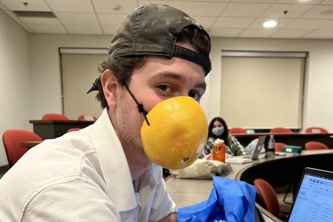 University Student Protests Mandate With Grapefruit ‘Mask’ One Day, Bucket on His Head Another