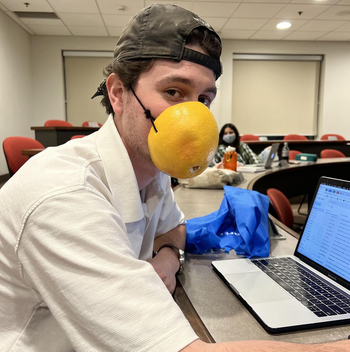 University Student Protests Mandate With Grapefruit ‘Mask’ One Day, Bucket on His Head Another