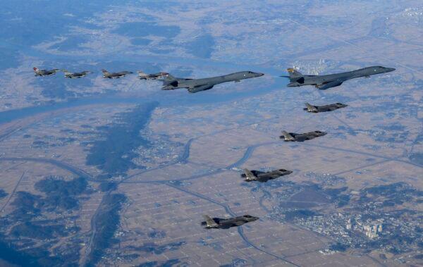 Two U.S. Air Force B-1B bombers, top center; four South Korean Air Force F-35 fighter jets; and four U.S. Air Force F-16 fighter jets fly over South Korea Peninsula during a joint air drill called "Vigilant Storm," in South Korea on Nov. 5, 2022. (South Korean Defense Ministry via AP)
