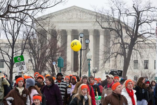 Pro-life activists stand near the U.S. Supreme Court in Washington on Jan. 23, 2012. (Brendan Hoffman/Getty Images)