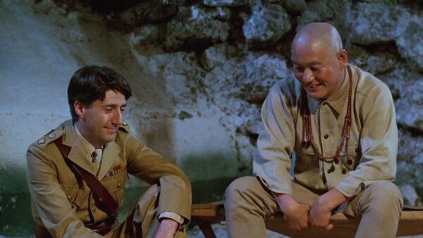 Prisoner Lt. Col. John Lawrence (Tom Conti, L) has a good relationship with Sergeant Hara (Takeshi Kitano) in “Merry Christmas Mr. Lawrence” (Shochiku Fuji)