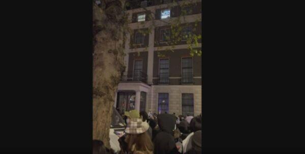 Demonstrators gathered outside the Chinese embassy in London on Sunday night Nov. 27, 2022, in solidarity over unrest in China. (Andy Li via AP/Screenshot via The Epoch Times)