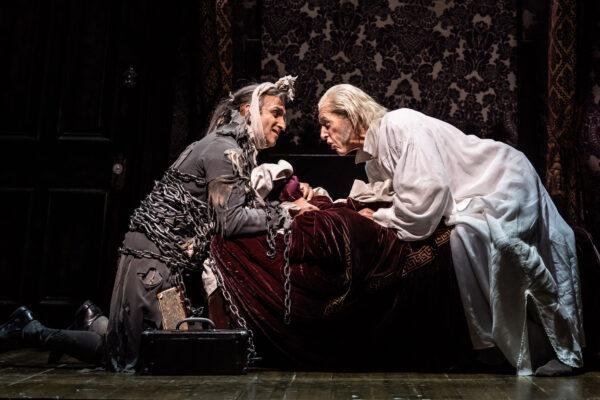 Jacob Marley (Kareem Bandealy, L) visits Ebenezer Scrooge (Larry Yando) on Christmas Eve, in the 45th annual production of “A Christmas Carol.” (Liz Lauren)