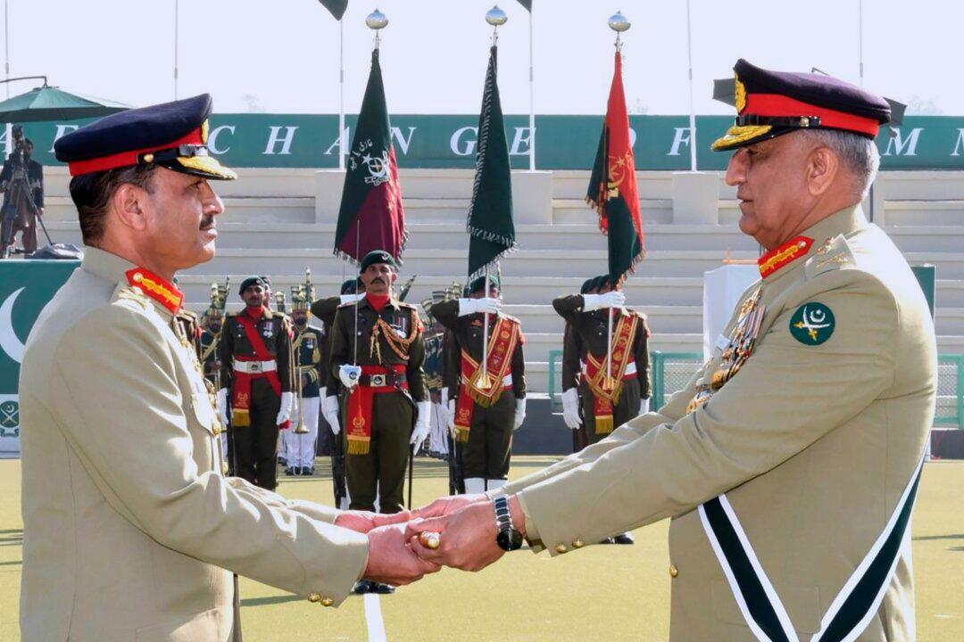 Pakistan’s Former Spy Chief Arrested Over Land Development Raid