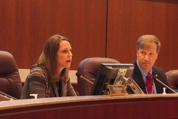 Loudoun County school board member Tiffany Polifko (L) speaks as chair Jeff Morse (R) looks on in Ashburn, Va., on Dec. 8, 2022. (Terri Wu/The Epoch Times)