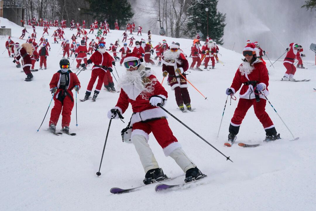 It’s All Downhill for 300 Skiing Santas, a Grinch, and a Tree