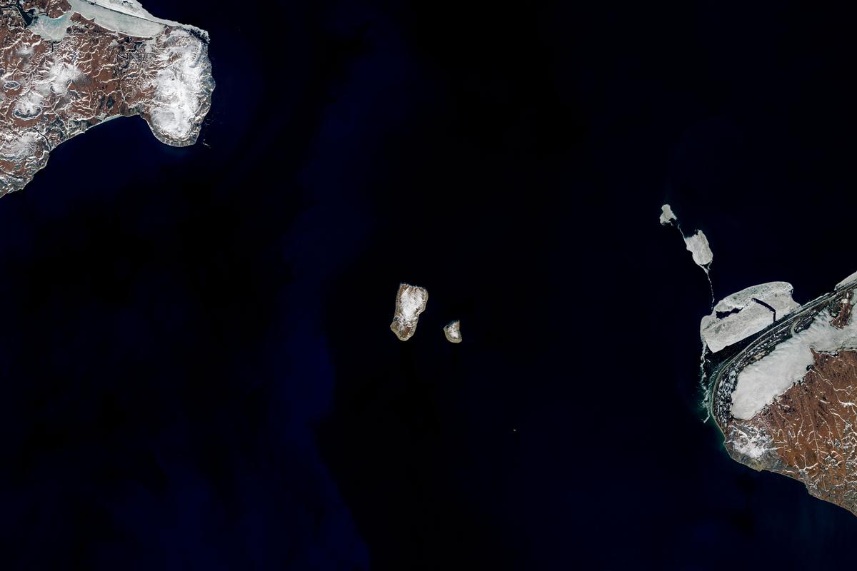 Tomorrow Island (Big Diomede) and Yesterday Island (Little Diomede) in the Bering Sea. (Joshua Stevens/NASA)
