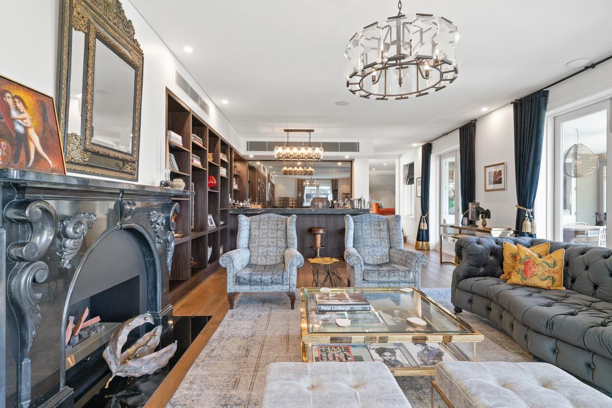 The living room is ideal for casual gatherings around a roaring fireplace. (Sydney Sotheby’s International Realty)