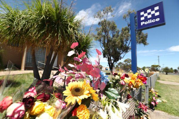 Tributes for the officers killed in the siege are seen at Tara Police Station in Tara, Queensland, Australia, on Dec. 14, 2022. (AAP Image/Jason O’Brien)
