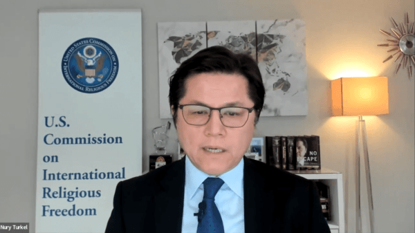 Nury Turkel, then the vice chair of the U.S. Commission on International Religious Freedom, speaks at a virtual hearing on China’s religious freedom violations on Dec. 14, 2022. (USCIRF/screenshot via NTD)