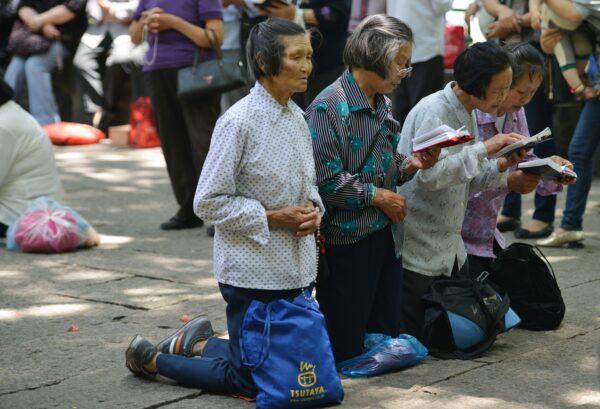 Catholics pray at Our Lady of Sheshan Basilica Catholic church in Shanghai on May 24, 2013. (Peter Parks/AFP via Getty Images)