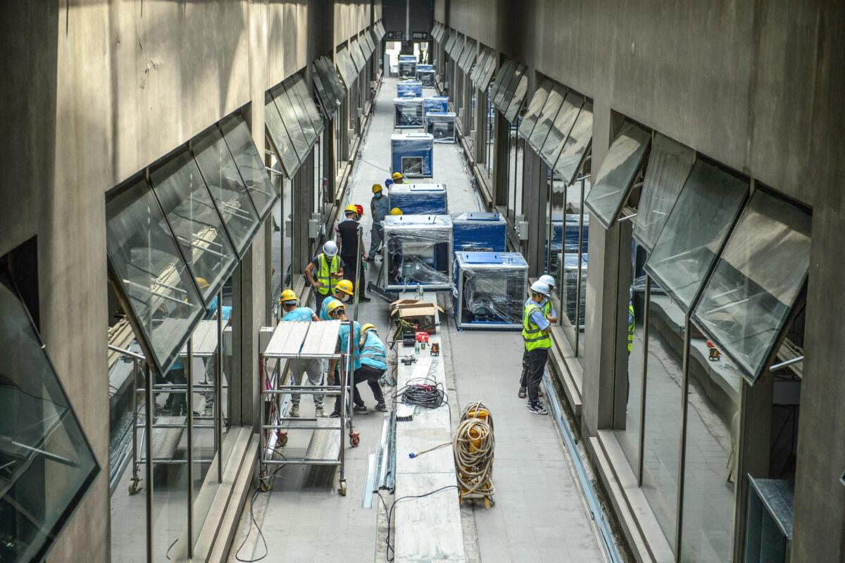 Employees work at a makeshift hospital that will be used for COVID-19 patients in Guangzhou, in China's eastern Guangdong province on April 11, 2022. (STR/AFP via Getty Images)