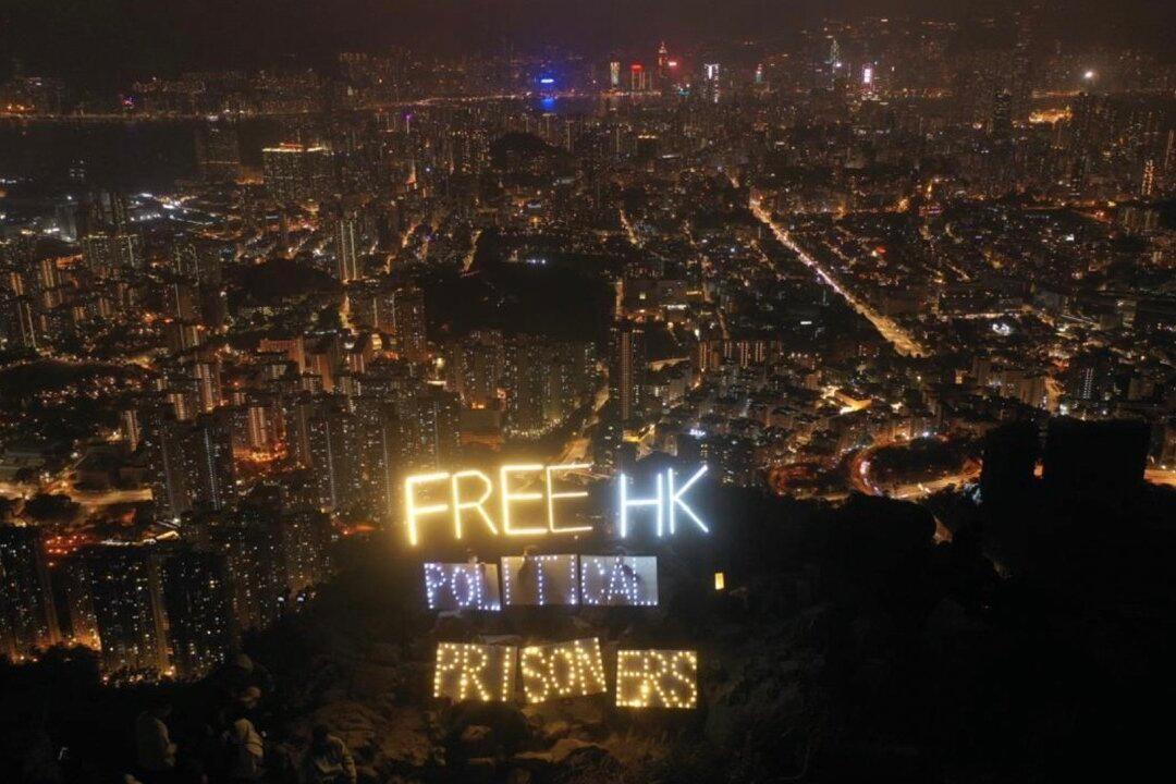 ‘Release Political Prisoners’ Sign Seen Atop Hong Kong’s Lion Rock on New Year’s Eve