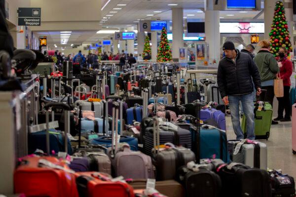 Stranded travelers search for their luggage at the Southwest Airlines Baggage Claim at Midway Airport. in Chicago on Dec. 27, 2022. (Jim Vondruska/Getty Images)