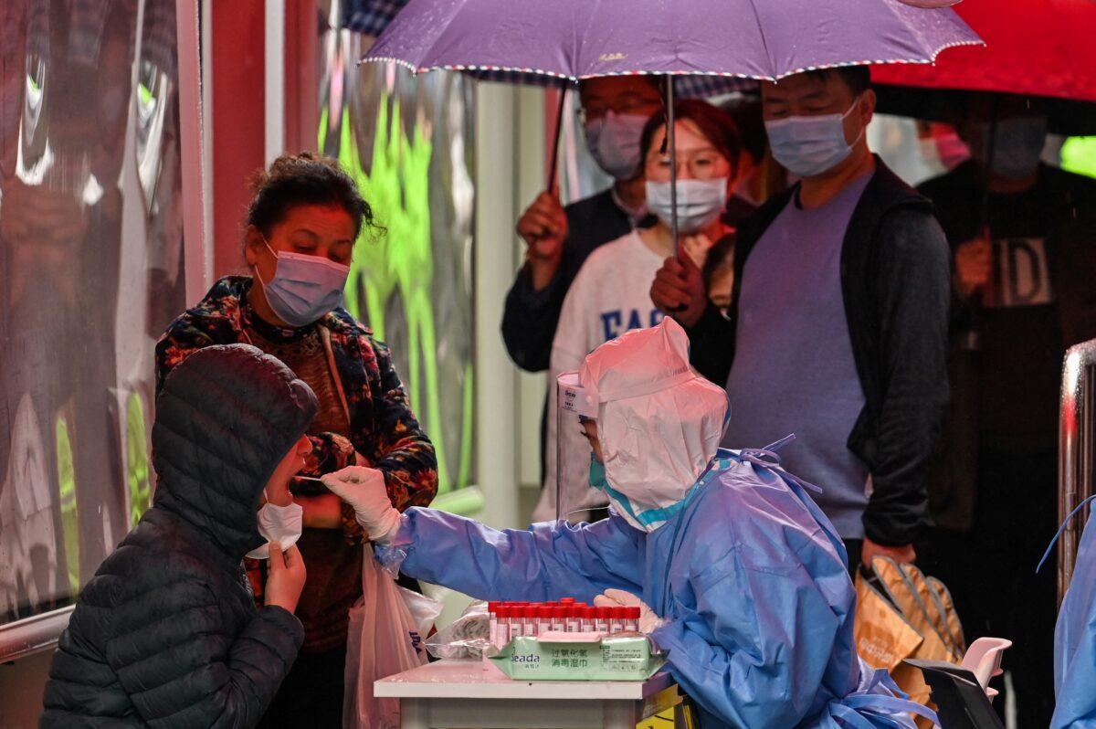 COVID-19 testing in a locked-down neighborhood in Shanghai, China, on March 17, 2022. (Hector Retamal/AFP via Getty Images)
