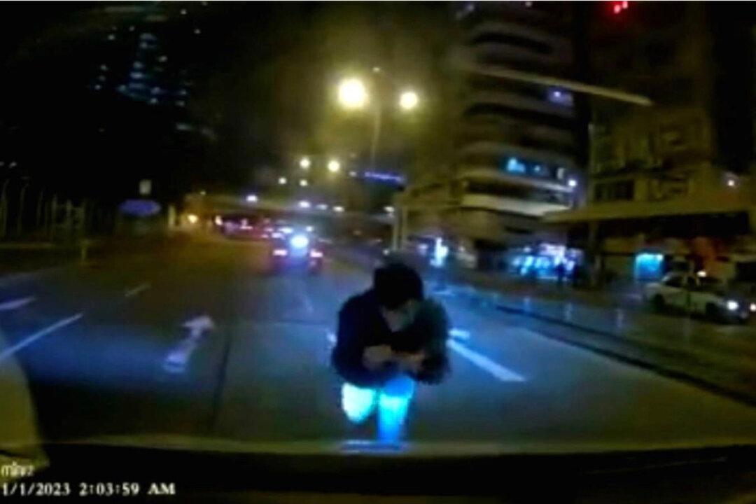 Man Who Threw Himself Onto Moving Car Arrested on Suspected Fraud