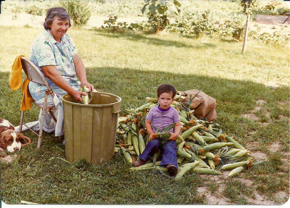 Jere Gettle (R) harvests sweet corn with his grandmother, Bertha Hernandez Gettle, 1983. (Baker Creek Heirloom Seed Co./RareSeeds.com)