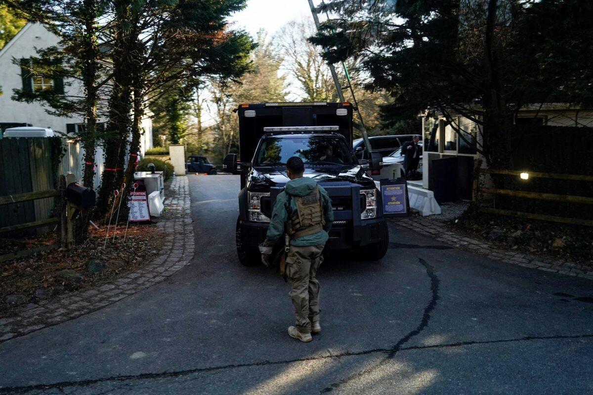 Secret Service personnel vehicles parked in the driveway leading to U.S. President Joe Biden's house after classified documents were found there by the president's lawyers in Wilmington, Del., on Jan. 15, 2023. (Joshua Roberts/Reuters)