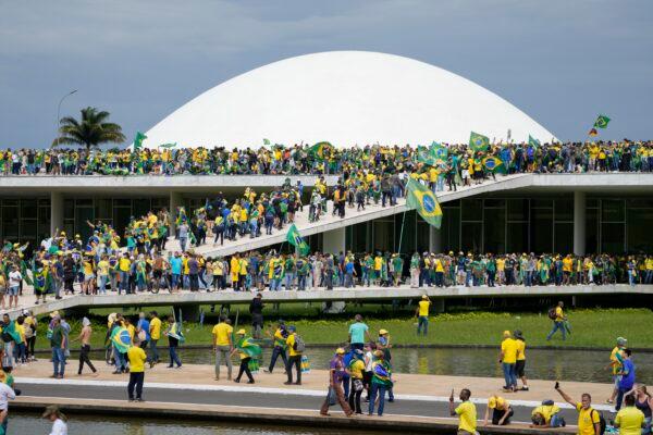 Protesters, supporters of Brazil's former President Jair Bolsonaro, storm the National Congress building in Brasília, Brazil, on Jan. 8, 2023. (Eraldo Peres/AP Photo)