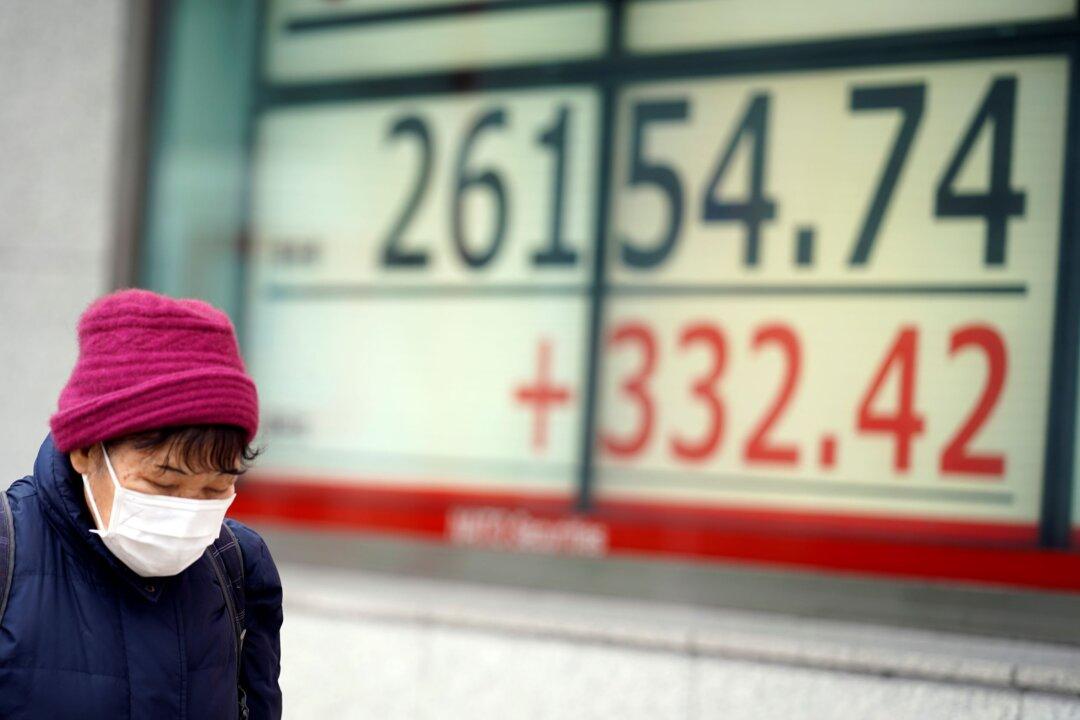 World Shares Slip as China Says Economy Slowed Further