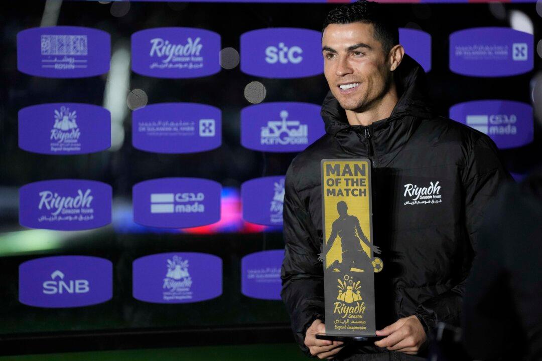 Bruised Ronaldo Scores Twice to Edge Showdown With Messi