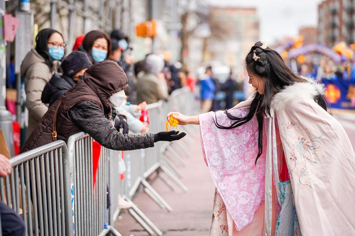Falun Gong practitioners take part in the Chinese New Year Parade in Flushing, N.Y., on Jan. 21, 2023. (Samira Bouaou/The Epoch Times)