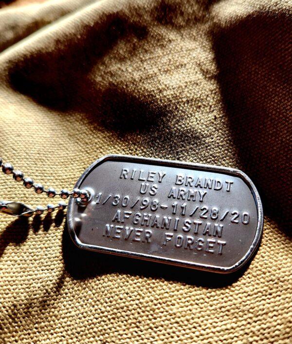 Each bag of coffee that's bagged and sold at Operation: Transition Outside the Wire comes attached with a replica version of an actual veteran's dog tag. All profits from the sale of coffee go to help veterans struggling with post-traumatic stress disorder and other service-related problems. (Allan Stein/The Epoch Times)