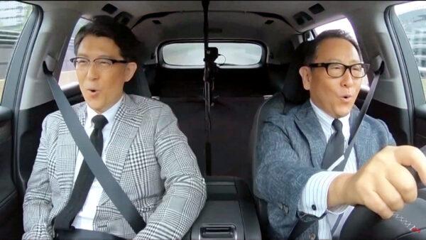 An undated photo shows Toyota Motor Corp. President Akio Toyoda (right) and Operating Officer Koji Sato test-riding Lexus's first electric vehicle model, RZ, in Japan in this photo provided on Jan. 26, 2023. (Kyodo/via Reuters)