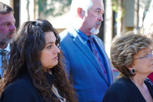 Republican Arizona state Rep. Michele Pena (L) from Yuma County listens as lawmakers describe the increasing toll of illegal immigration and drug cartels operating along Arizona's southern border at a press conference in Phoenix on Jan. 26, 2023. (Allan Stein/The Epoch Times)