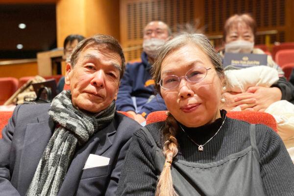Mr. Okachi Storu, the owner and president of a Buddhist products store, attends Shen Yun Performing Arts at the Aichi Prefectural Art Theater with his wife, in Nagoya, Japan, on Jan. 30, 2023. (Xiao Lei/The Epoch Times)
