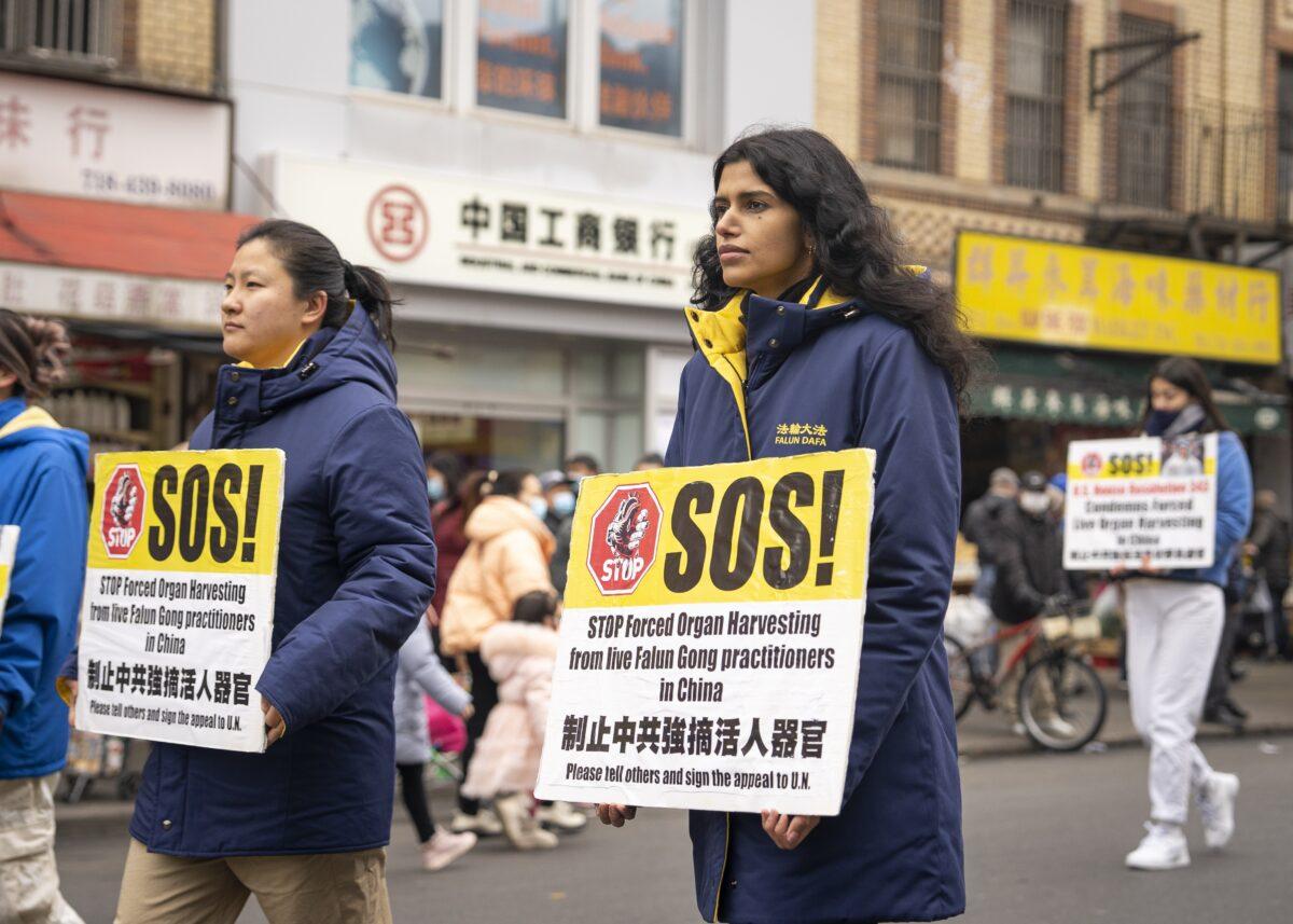 Falun Gong practitioners walk in a parade in Brooklyn, N.Y., highlighting the Chinese regime's persecution of their faith on Feb. 26, 2023. (Chung I Ho/The Epoch Times)