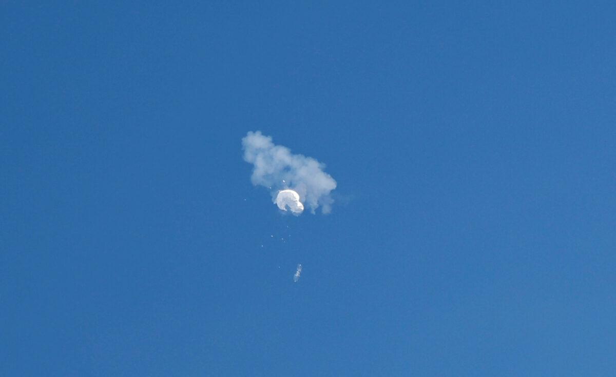 The Chinese spy balloon drifts to the ocean after being shot down off the coast in Surfside Beach, S.C., on Feb. 4, 2023. (Randall Hill/Reuters)
