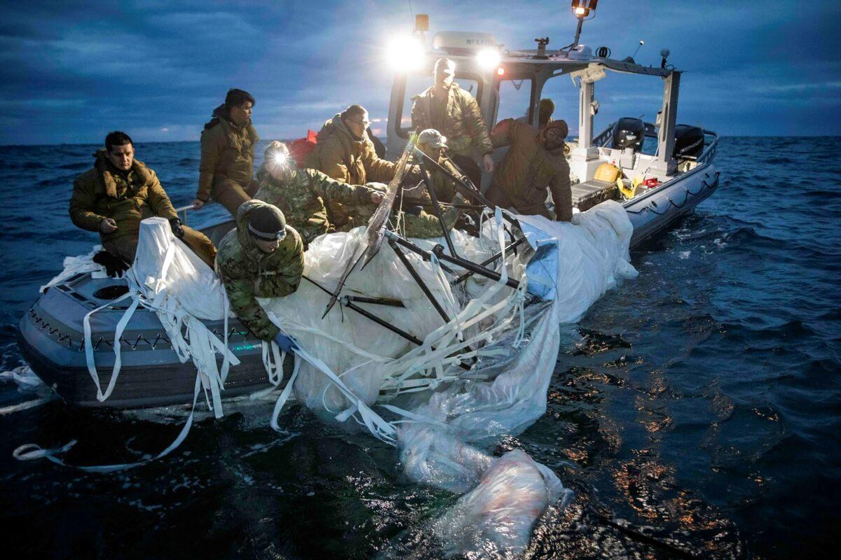Sailors assigned to Explosive Ordnance Disposal Group 2 recover a high-altitude surveillance balloon off the coast of Myrtle Beach, S.C., on Feb. 5, 2023. (Petty Officer 1st Class Tyler Thompson/U.S. Navy via Getty Images)