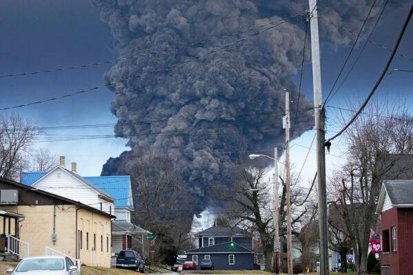 A black plume rises over East Palestine, Ohio, as a result of a controlled detonation of a portion of the derailed Norfolk Southern trains on Feb. 6, 2023. (Gene J. Puskar/AP Photo)
