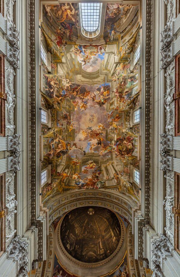 Italian painter and lay Jesuit brother Andrea Pozzo created the spectacular illusionistic painted ceiling in the nave of Rome's Church of St. Ignatius of Loyola. Pozzo's composition shows Christ and the Virgin Mary welcoming the founder of the Jesuit order, St. Ignatius, into paradise. (<a class="extiw" title="d:Q28147777" href="https://www.wikidata.org/wiki/Q28147777"><span title="Spanish photographer (1974-)">Diego Delso</span></a>/<a href="https://commons.wikimedia.org/wiki/File:Iglesia_de_San_Ignacio_de_Loyola,_Roma,_Italia,_2022-09-15,_DD_27-29_HDR.jpg">CC-BY-SA 4.0</a>)