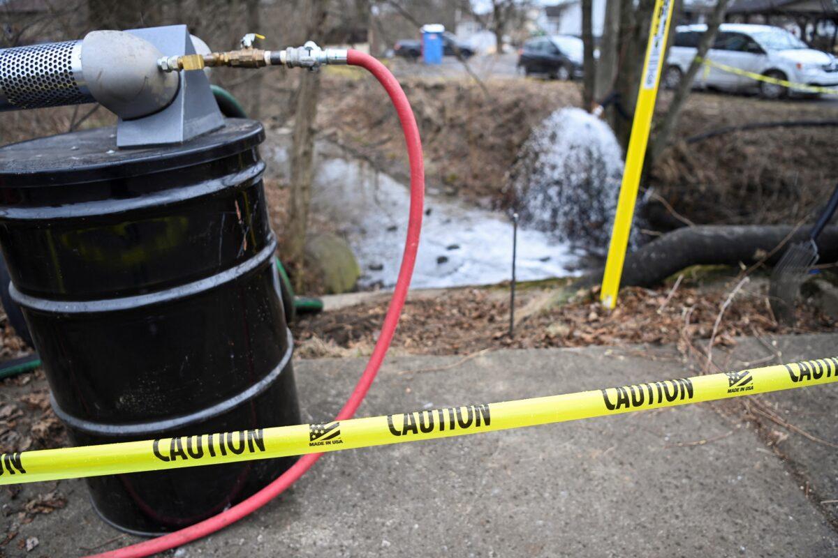 Caution tape surrounds areas affected by the derailment of a train carrying hazardous materials as members of the U.S. Environmental Protection Agency (EPA) are due to arrive at the site in East Palestine, Ohio, on Feb. 16, 2023. (Alan Freed/Reuters)