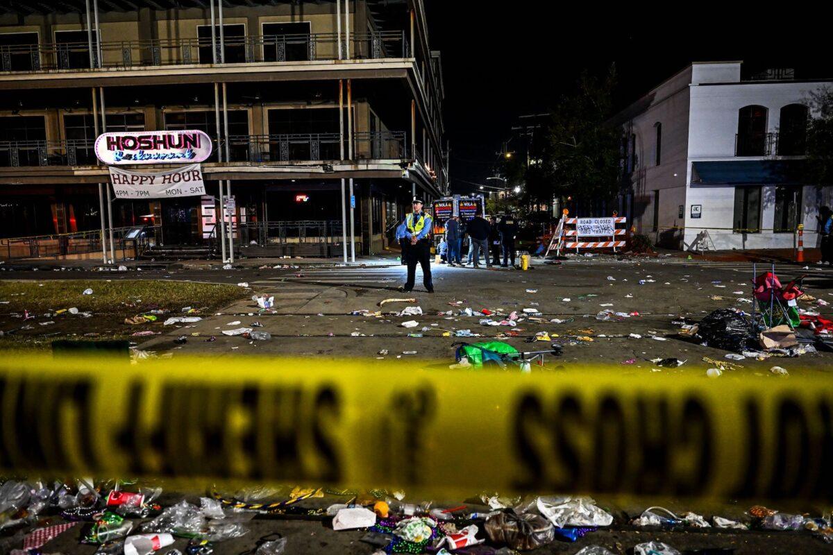 Police officers work at the scene of a shooting that occurred during the Krewe of Bacchus parade in New Orleans, Louisiana, on Feb. 19, 2023. (Chandan Khanna/AFP/Getty Images)